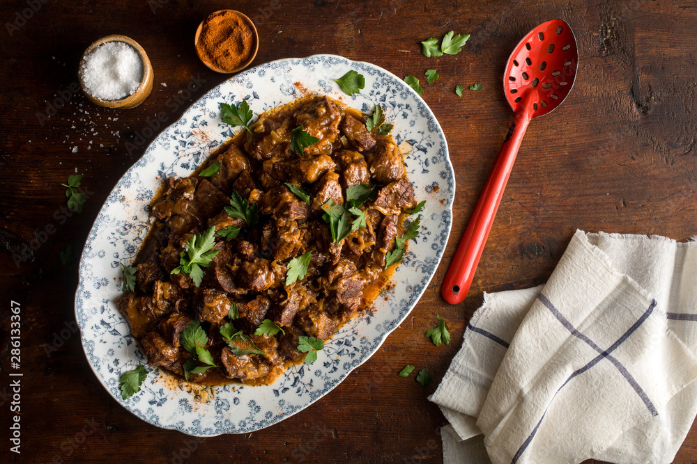 Overhead view of beef carbonnade served on plate